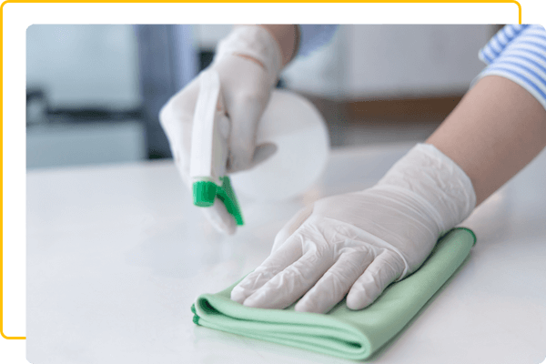person cleaning countertop person cleaning countertop