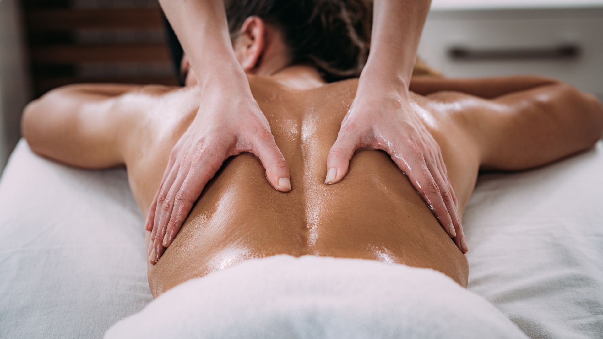 Person getting a sports massage on their back. 