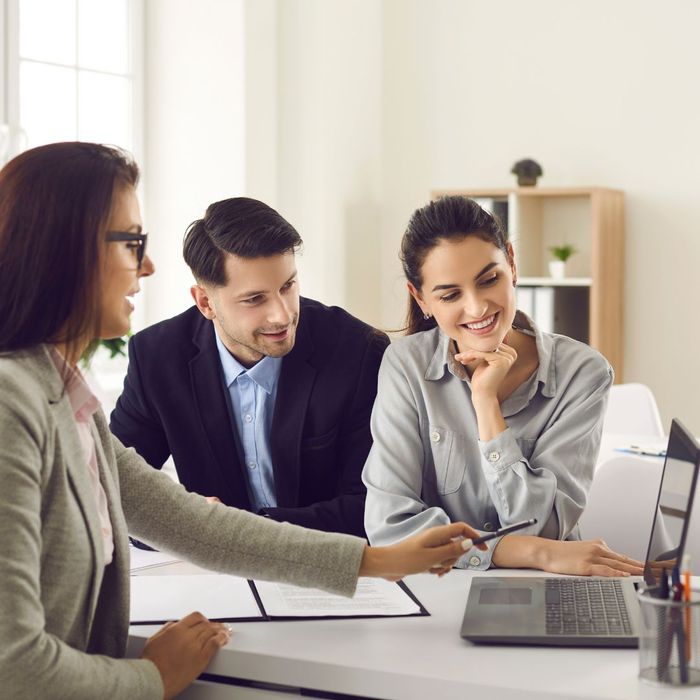 couple talking with a real estate agent