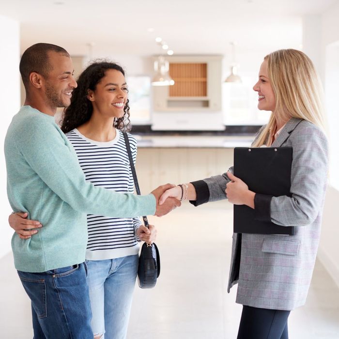 couple working with real estate agent