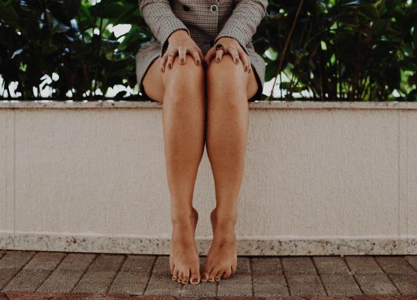 woman sitting outside with smooth legs