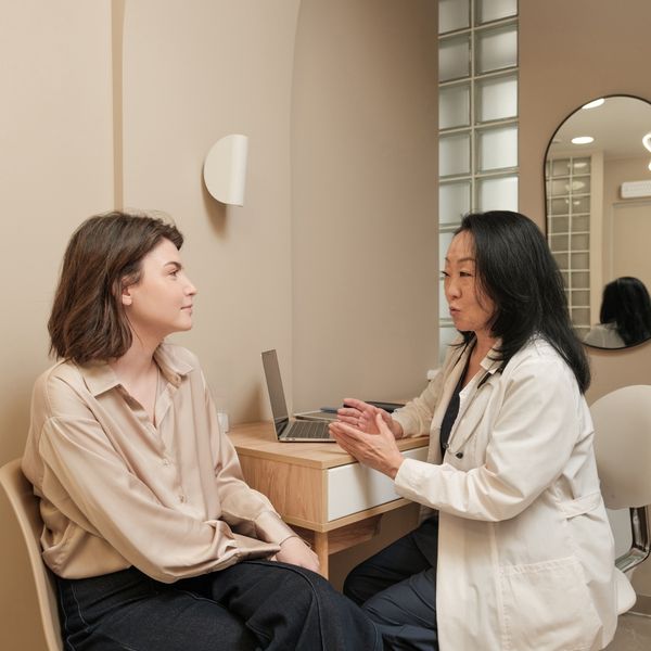 medical professional consults with a woman