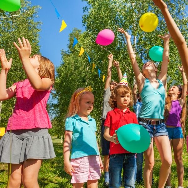 Kids playing outside at a party.