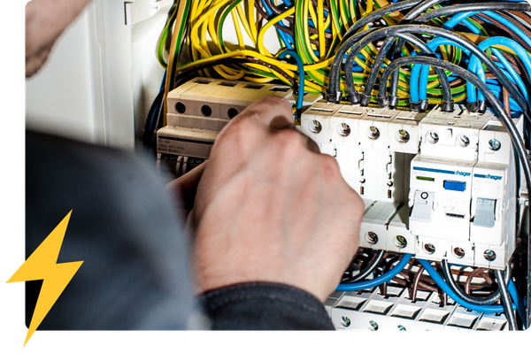 man working on an electrical panel
