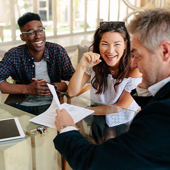 Real Estate agent talking to couple