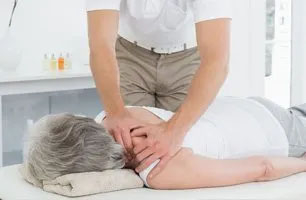 Chiropractor working on patient Chiropractor working on patient
