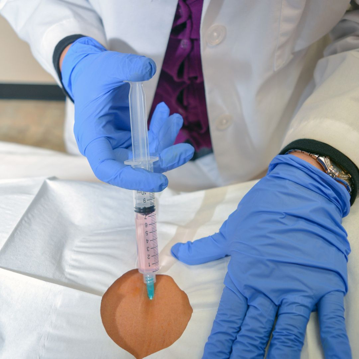 doctor injecting stem cells into back