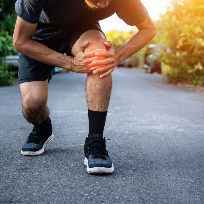 person holding knee