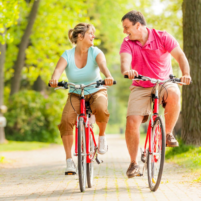 couple riding bikes pain free