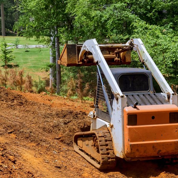 a machine being used to move dirt Webster (2).jpg