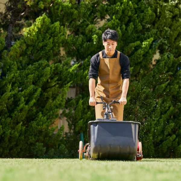 a man fertilizing a lawn Webster.jpg