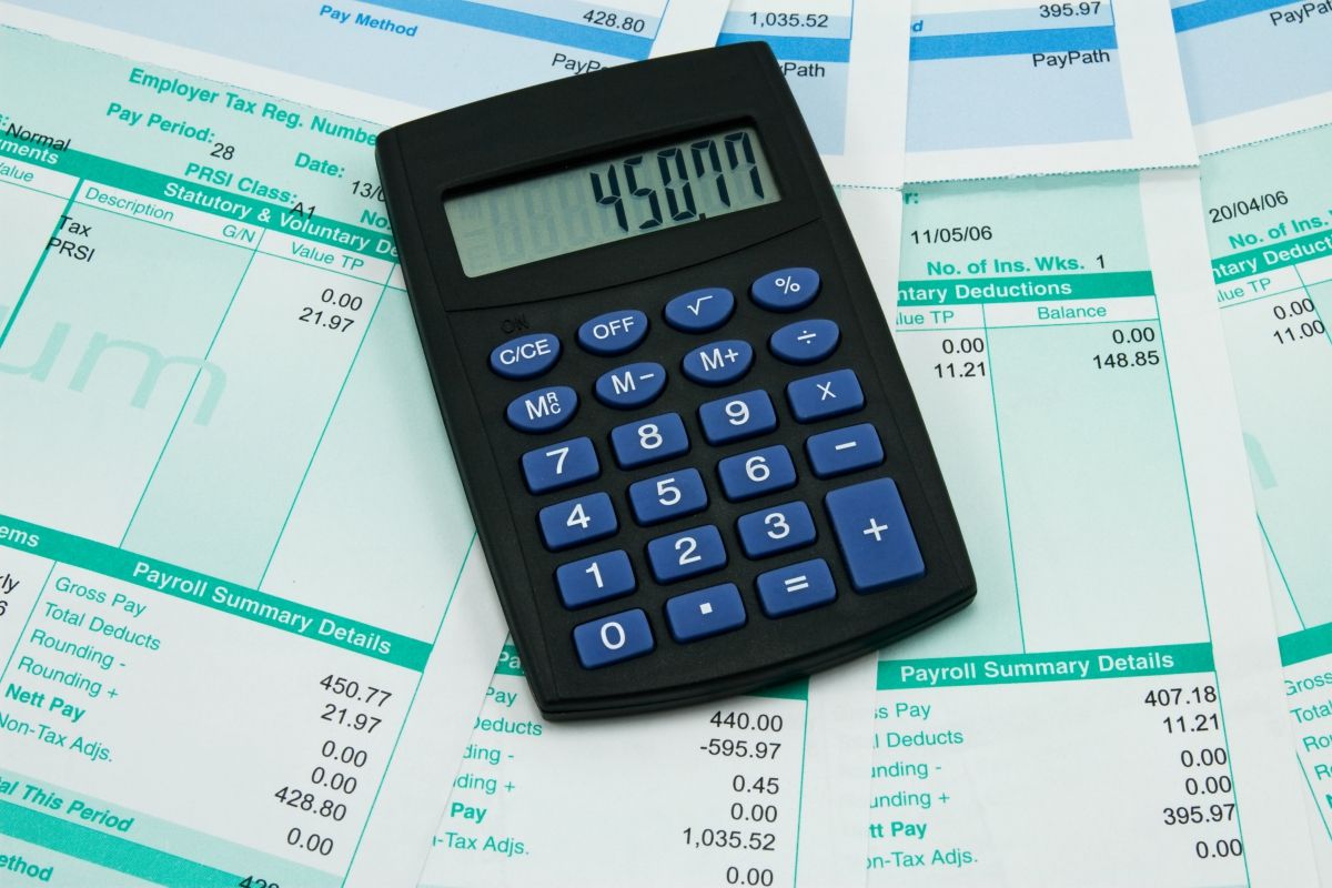 A calculator on top of income paperwork