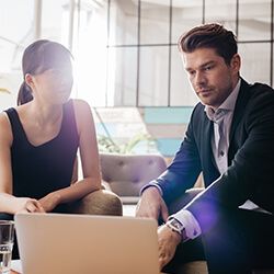 A man and women in a meeting