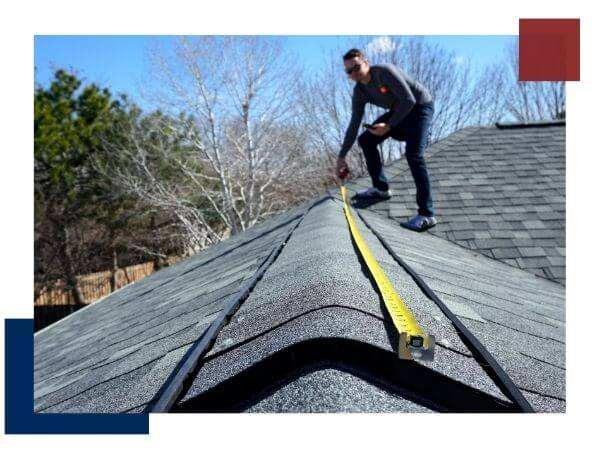 roofing contractor taking measurements