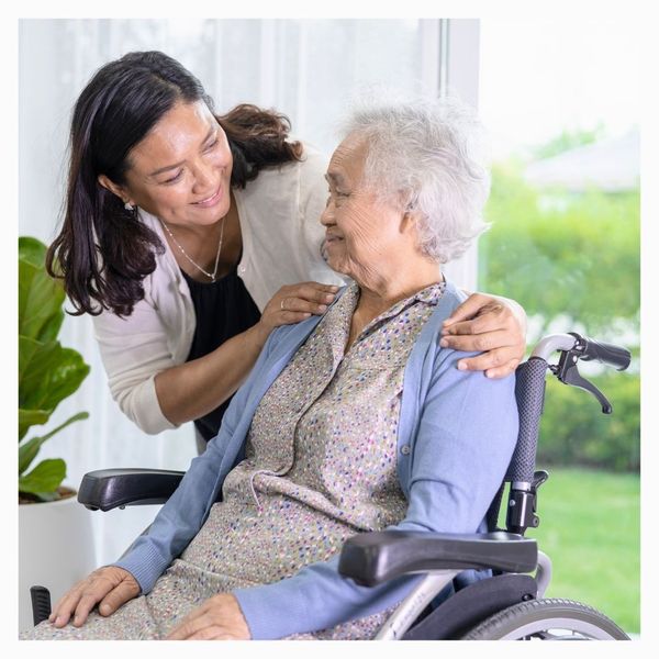 senior woman in wheelchair with daughter