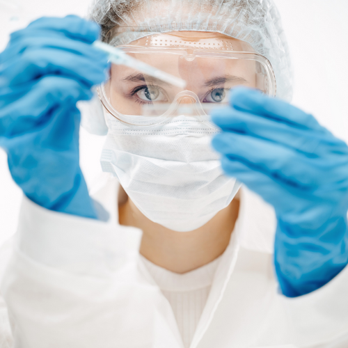 woman scientist holding test tube woman scientist holding test tube