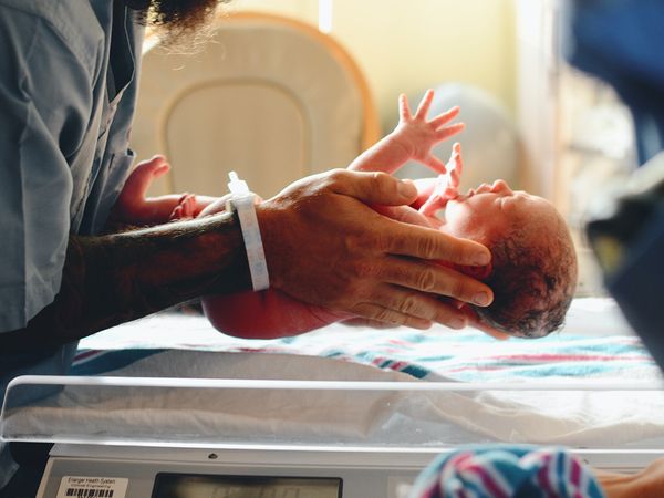 Nurse holding a newborn baby