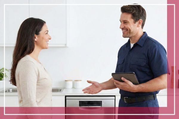 dishwasher repair tech and homeowner