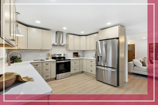 A clean and modern kitchen with light-colored cabinets, a stainless steel refrigerator, and a stove. A clean and modern kitchen with light-colored cabinets, a stainless steel refrigerator, and a stove.