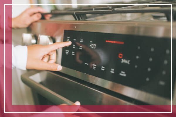 person cooking in oven
