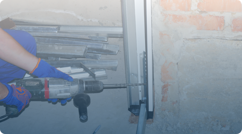 garage door contractor fixing tracks