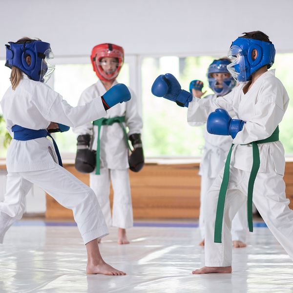 Image of kids sparing with head gear and gloves