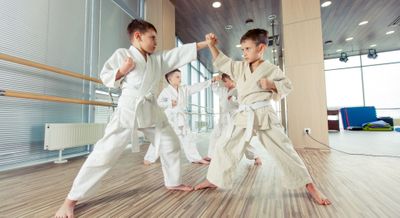 kids practicing martial arts in a studio