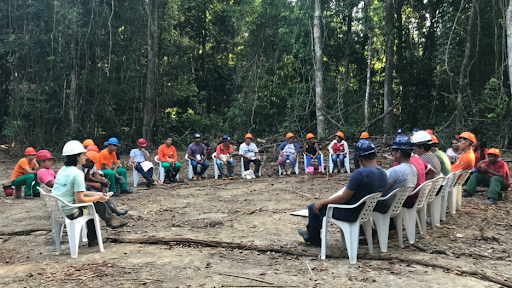 people sitting around in a circle creating plan 