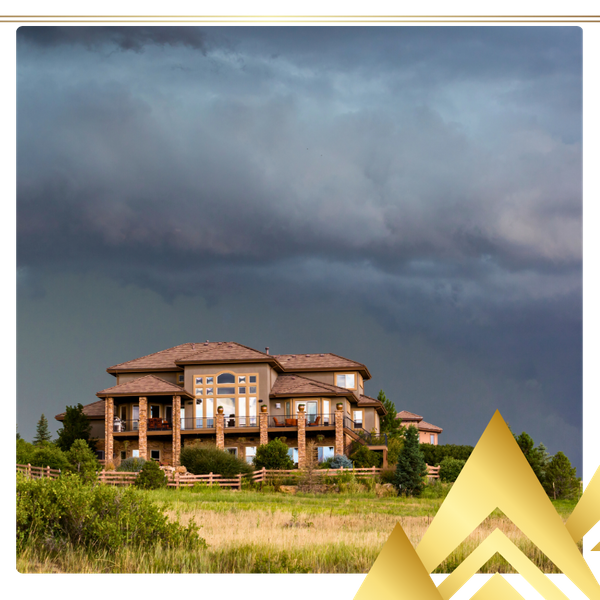 a Colorado home against dark storm clouds