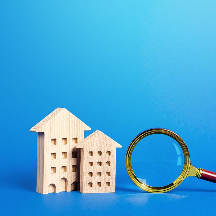 Wood buildings with a magnifying glass