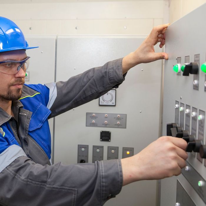 technician working on electrical panel