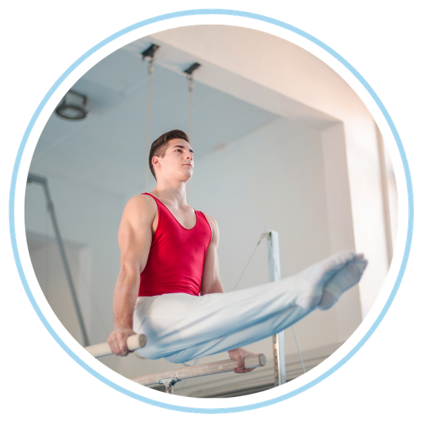 man practicing parallel bars in adult gymnastics