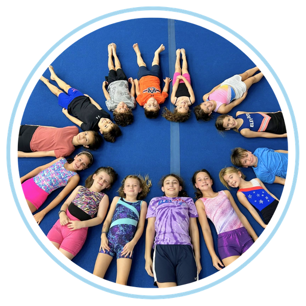 kid gymnasts lying in a circle