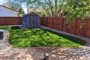 backyard grass with a paver perimeter