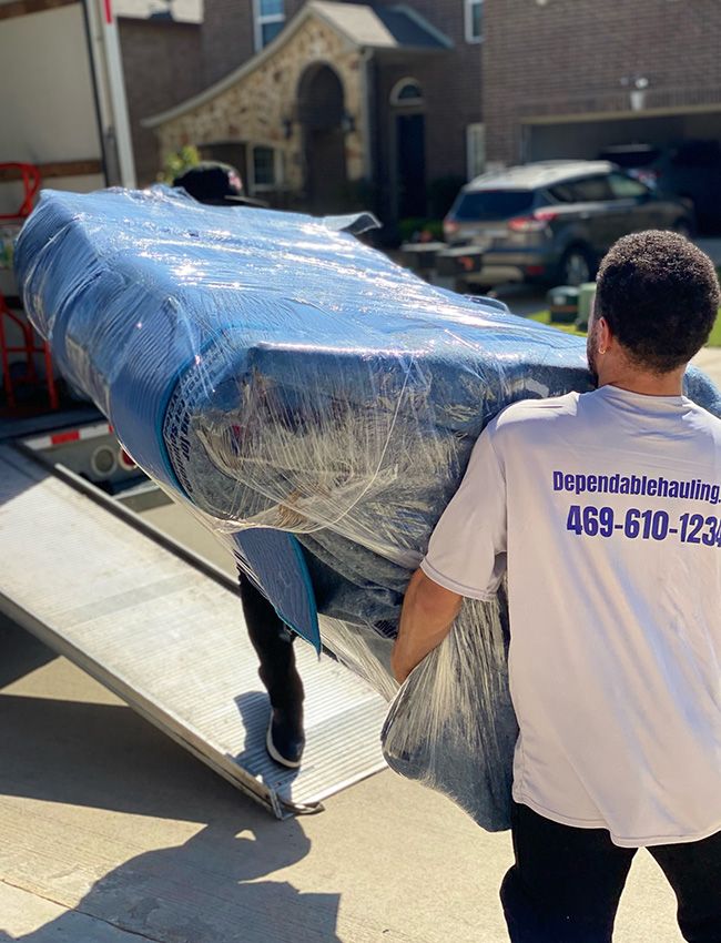Men moving furniture into moving truck