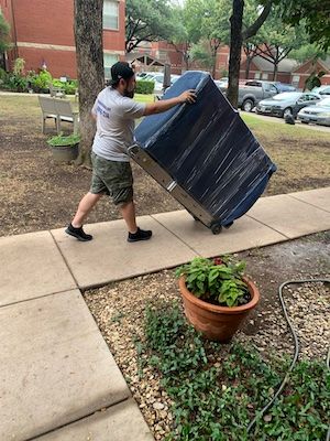 Man moving appliance