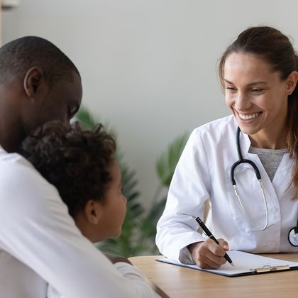 doctor talking to a parent and child