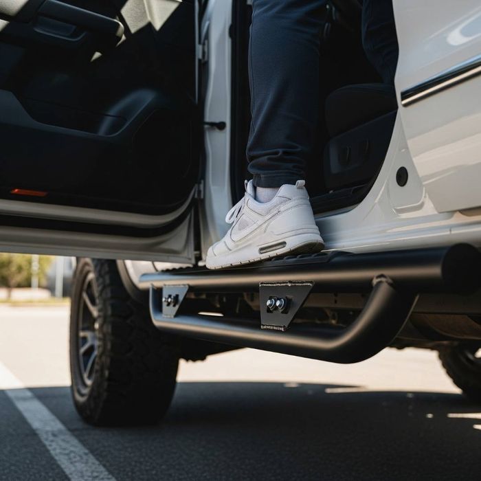 person stepping up onto step bar to get into truck person stepping up onto step bar to get into truck