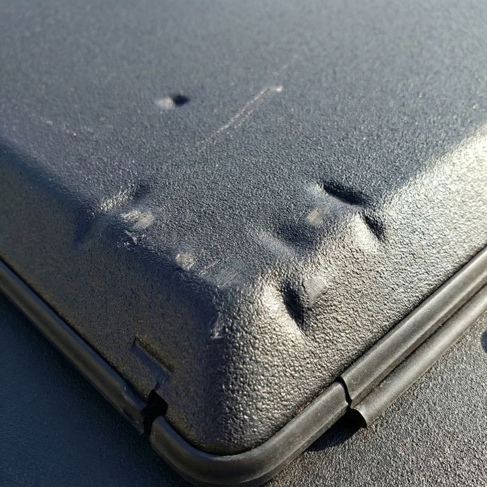 a rugged, black aluminum tonneau cover