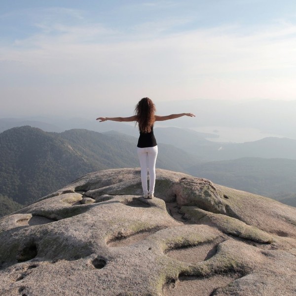 happy peaceful woman at summit