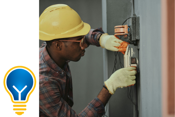 man working on an electrical box