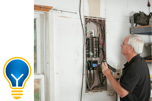 man working on an electrical panel