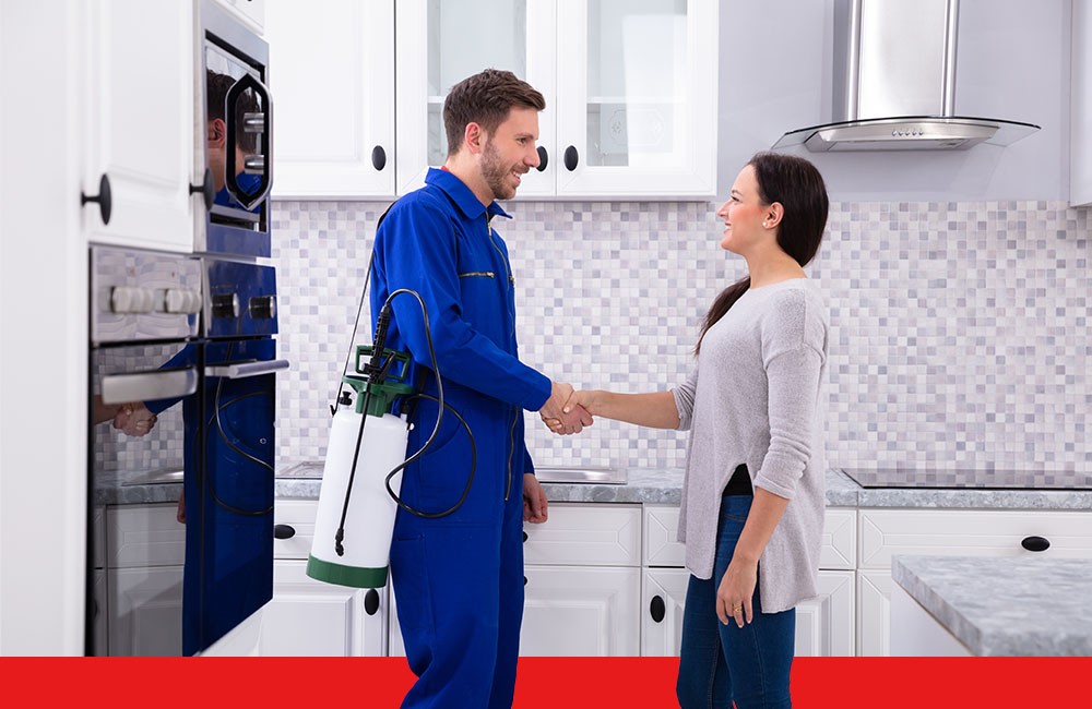 pest control shaking hands with customer