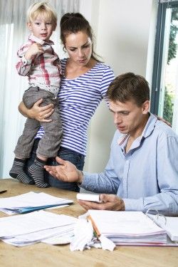 parents looking upset at paperwork