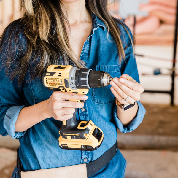 woman holding a drill