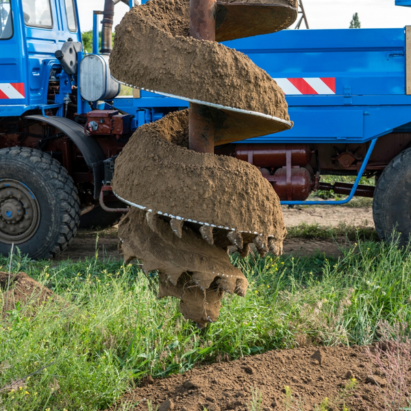 Twist drill bit covered in dirt