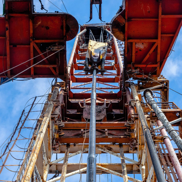 Looking up at an oil rig about to drill into land