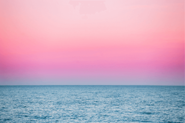 blue water and pink sky