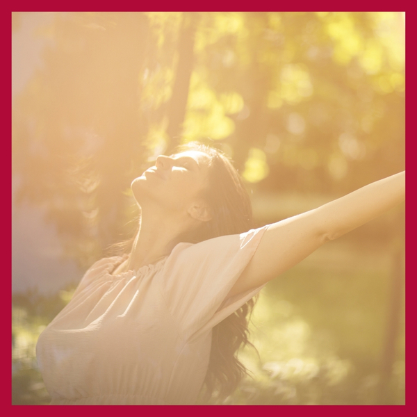 image of a happy woman in the sun