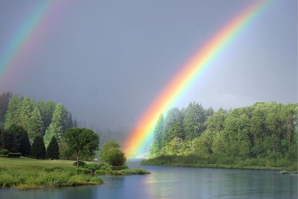 lake with a rainbow in the background